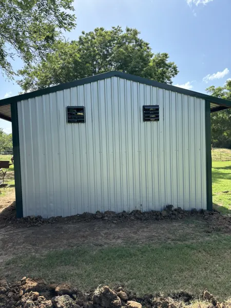 White metal shed with green trim, Pottsboro, TX