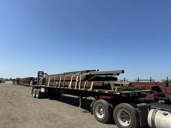 Steel beams and columns loaded on a flatbed for delivery, Howe, TX