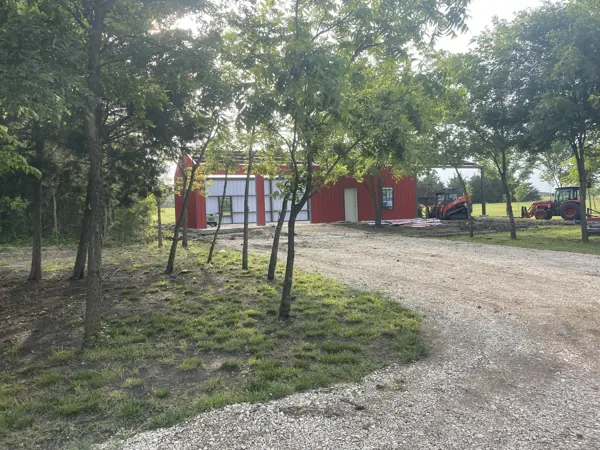 Small red metal shed among the trees, Van Alstyne, TX