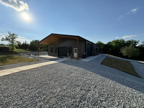 Barndominium at sunset with a gravel drive, Van Alstyne, TX
