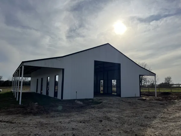 Grey metal building with an open end wall, Van Alstyne, TX