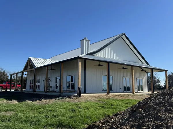 White standing seam roof on a stone and metal home, Van Alstyne, TX