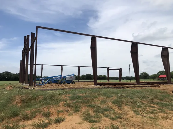 Steel columns set on a pasture site before framing, Whitesboro, TX