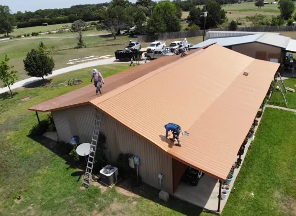 New tan metal roof on a house seen from above, Sherman, TX