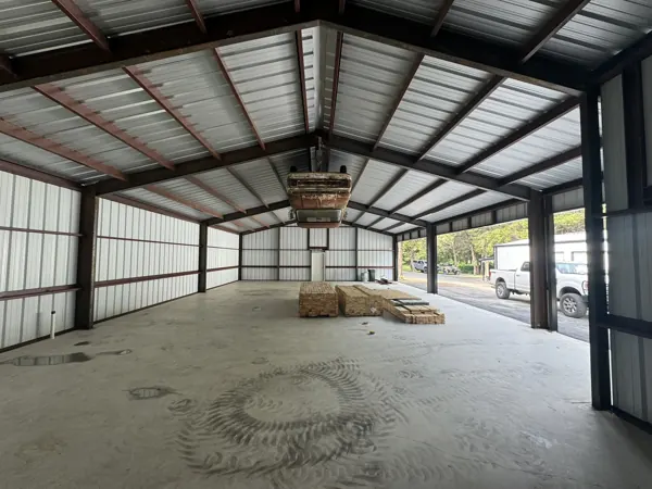 Scissor lift inside a steel-framed building, Sherman, TX