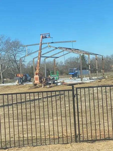 Crane setting the steel frame, Sherman, TX