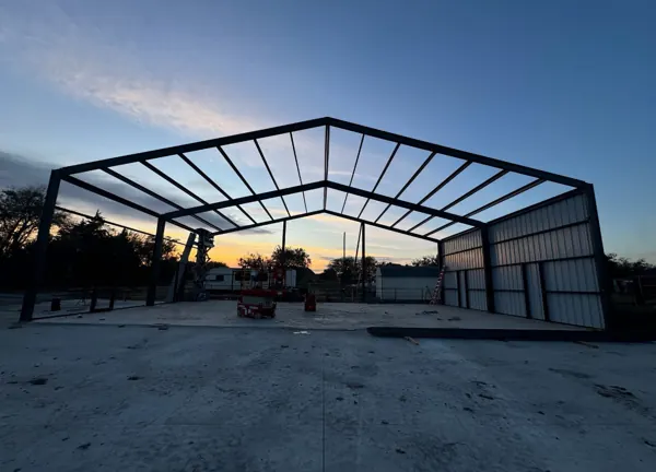 Steel building frame at dusk, Sherman, TX
