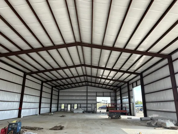 Inside a steel building frame with the roof panels on, Denison, TX