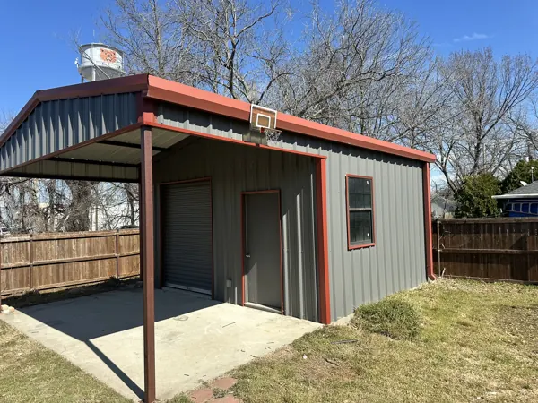 Metal carport with a grey shop behind, Tom Bean, TX