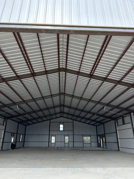 Metal roof on a steel-framed covered structure, Sherman, TX