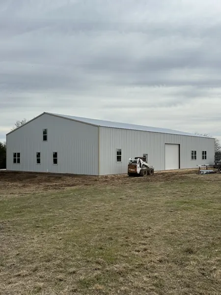 Large white metal warehouse on a fresh pad, Denison, TX
