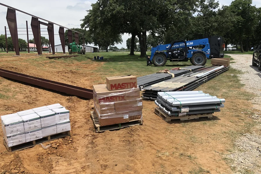 Palletised steel panels and materials ready for delivery by Metal Warehouse Inc.